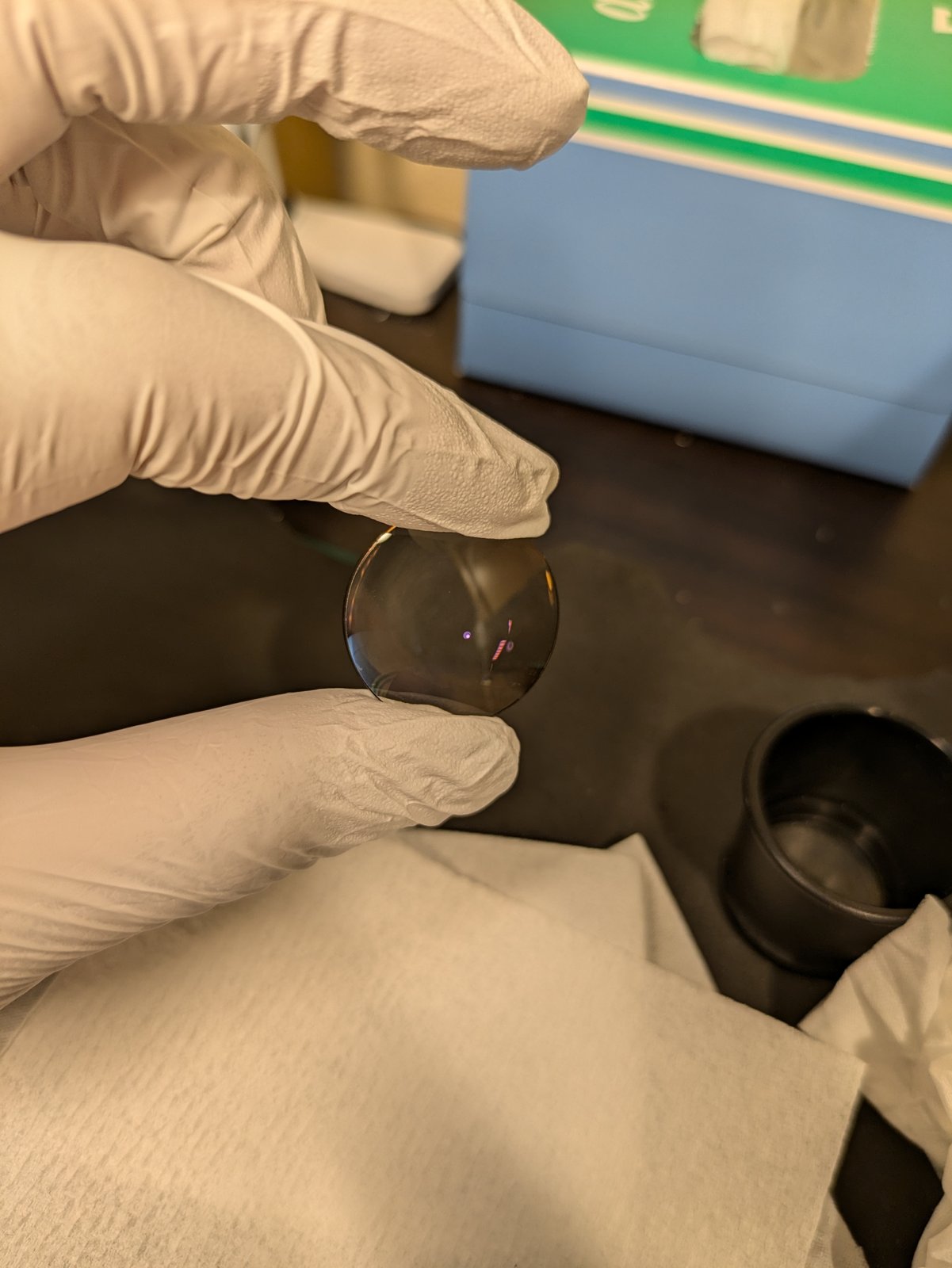 A cleaned element held with gloves