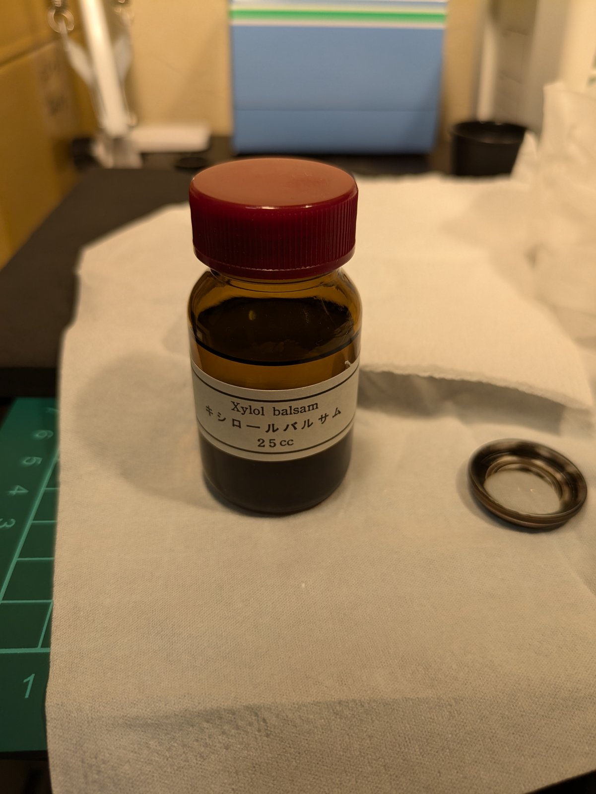A bottle of xylol balsam next to the cemented pair